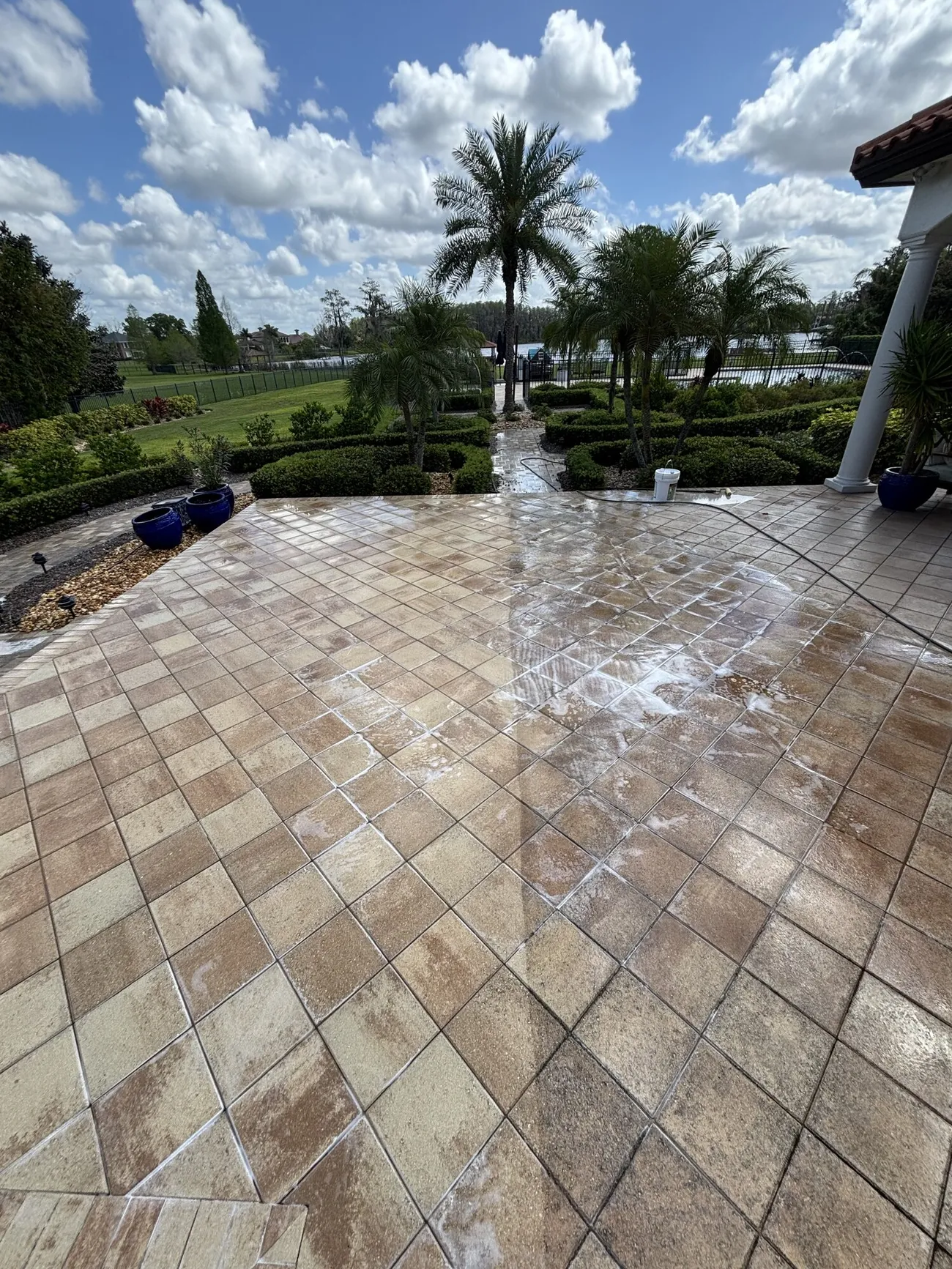 The same travertine patio after sealing, color and depth restored